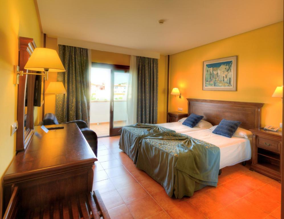 Postel nebo postele na pokoji v ubytování Hotel Porfirio