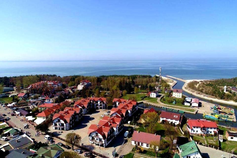 an aerial view of a village by the ocean at Apartament Sun&Fun - Rowy in Rowy