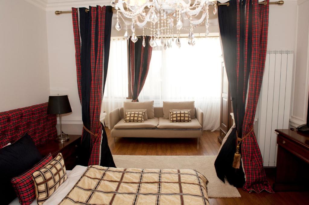 Postel nebo postele na pokoji v ubytování Boutique Vila Paradis
