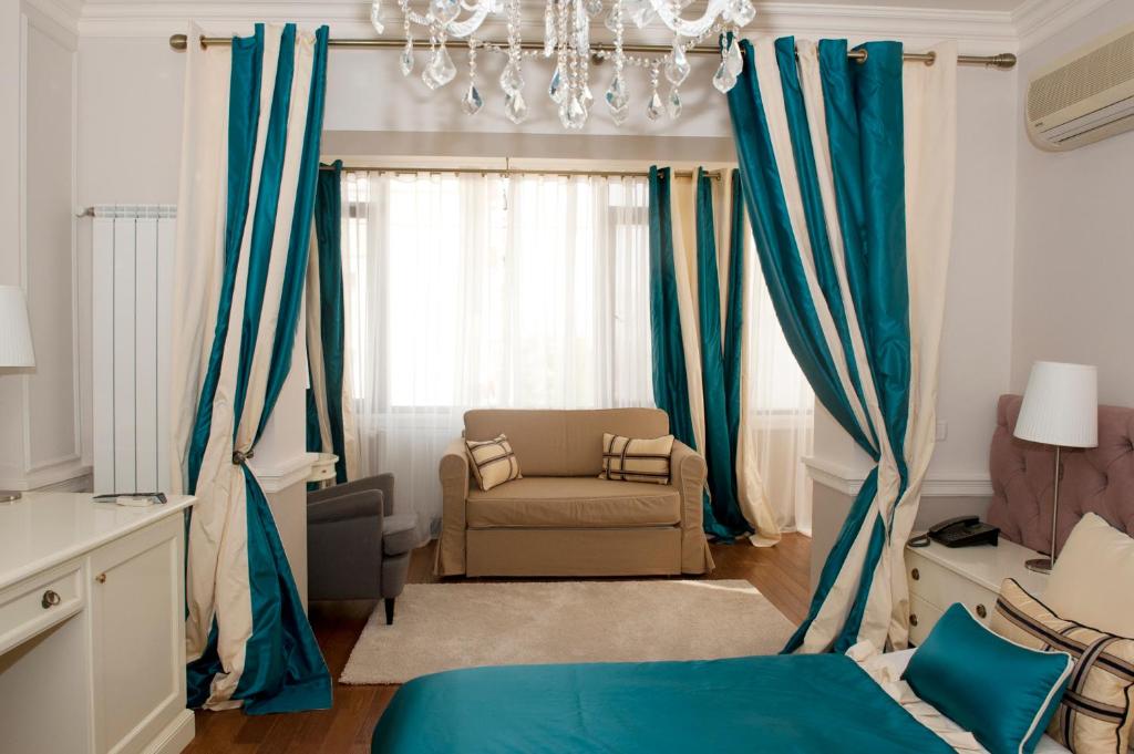 Postel nebo postele na pokoji v ubytování Boutique Vila Paradis
