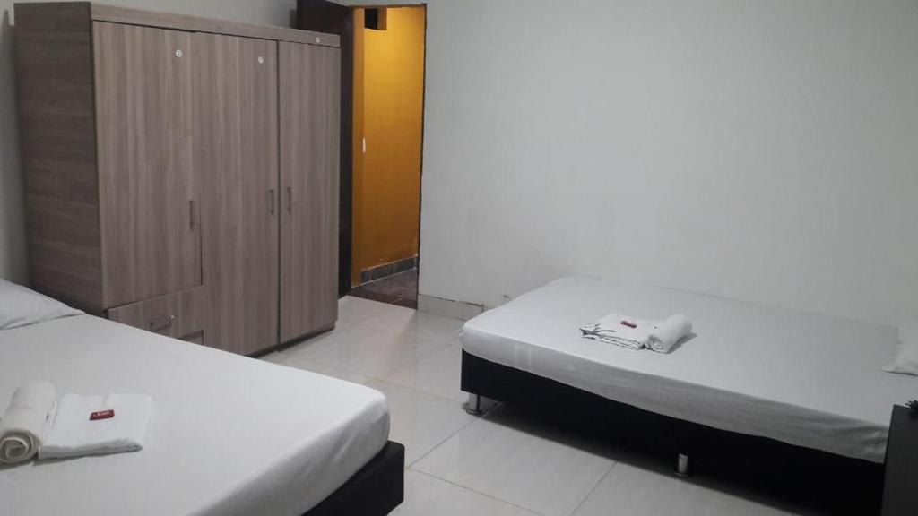 Postel nebo postele na pokoji v ubytování montecarlos hotel