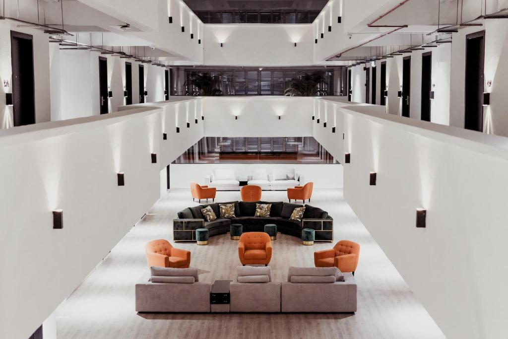 A dramatic multi-level lobby lounge arranged around a central seating area.