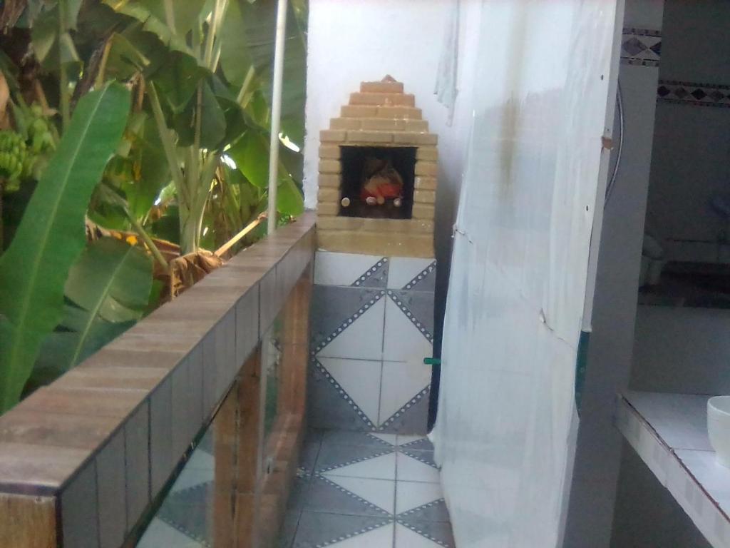 a fireplace in the floor of a room at Casa de Veraneio em Ilhéus-BA - nas praias do Sul - Olivença in Ilhéus