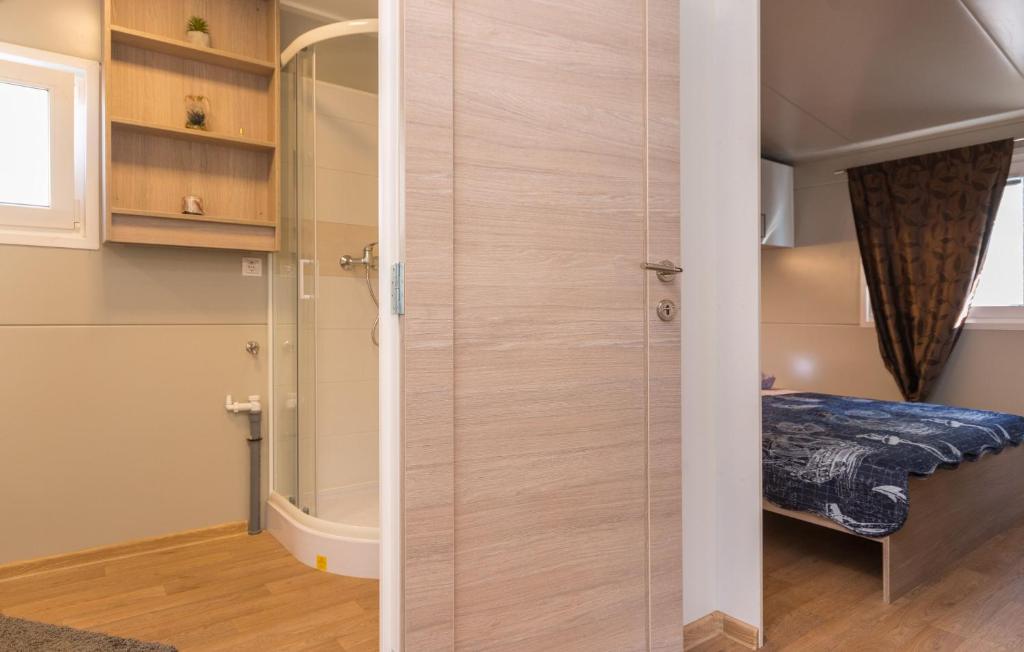 Postel nebo postele na pokoji v ubytování Mobile home Rock Rose 1