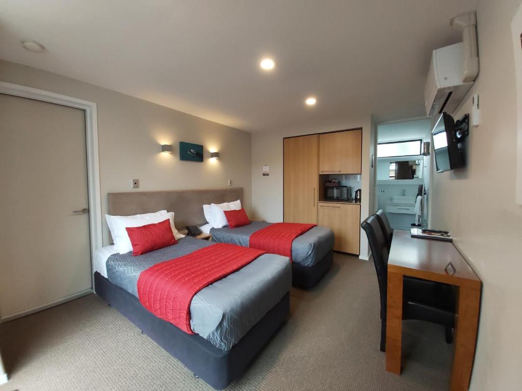 Postel nebo postele na pokoji v ubytování The Fairways Accommodation Kaikoura