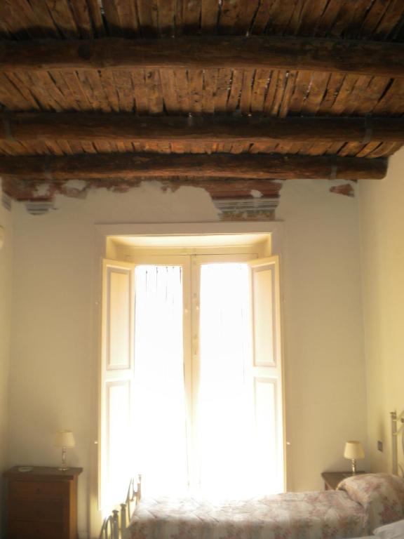 Postel nebo postele na pokoji v ubytování B&B Palazzo Lanza