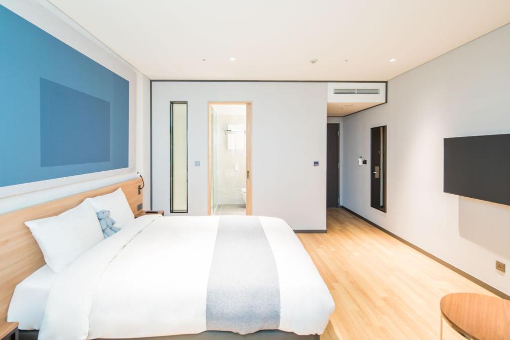 Postel nebo postele na pokoji v ubytování Ibis Ambassador Suwon