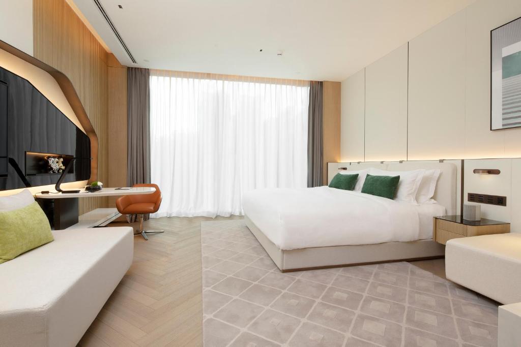 Postel nebo postele na pokoji v ubytování Shenzhen Ayearn Hotel