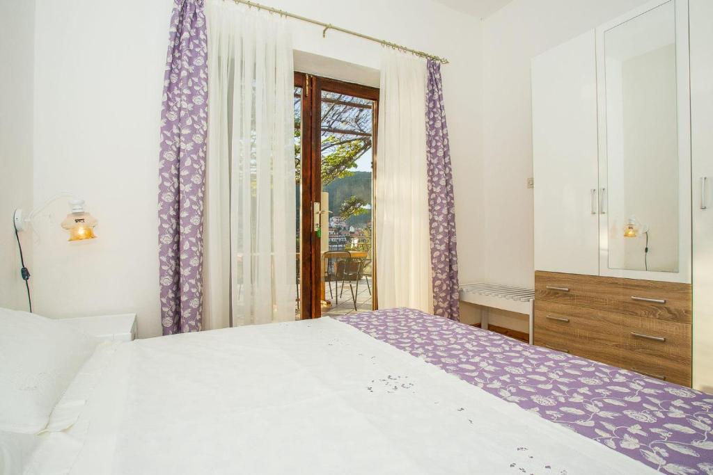 Postel nebo postele na pokoji v ubytování Apartments Robert