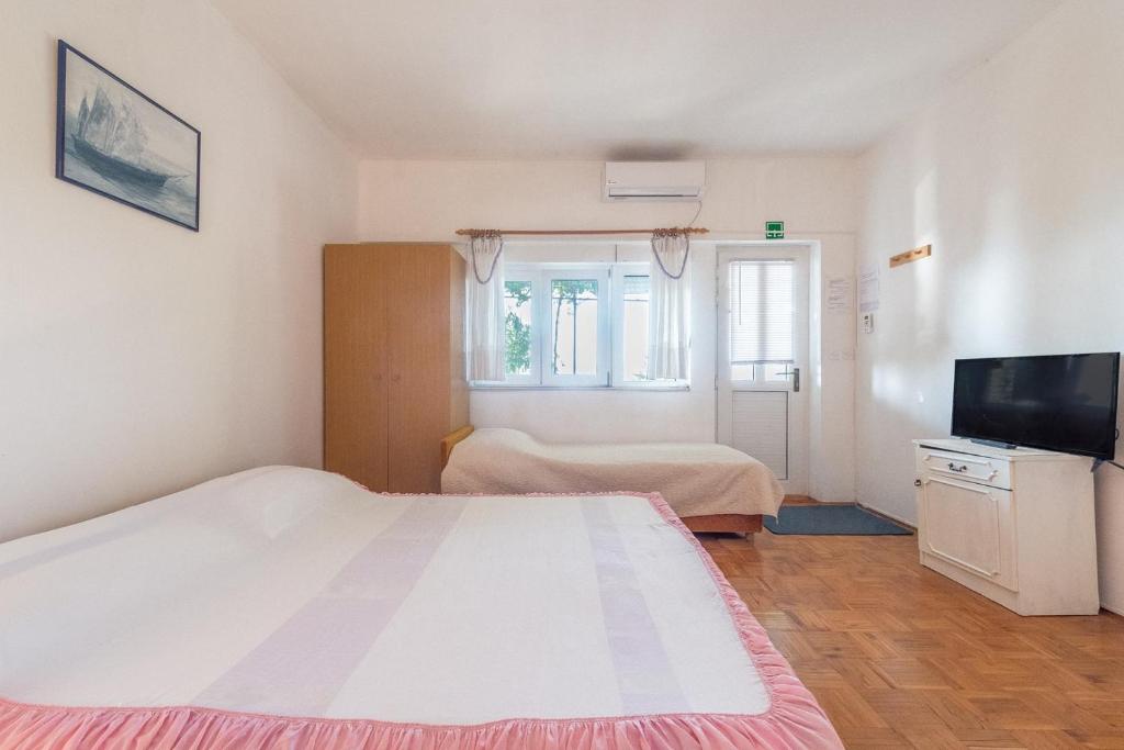 Posteľ alebo postele v izbe v ubytovaní Apartments Blaženka