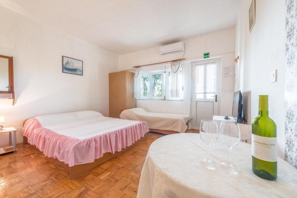Posteľ alebo postele v izbe v ubytovaní Apartments Blaženka