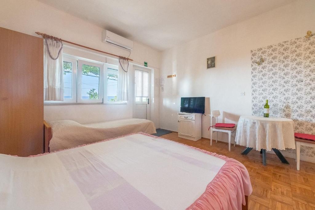 Posteľ alebo postele v izbe v ubytovaní Apartments Blaženka