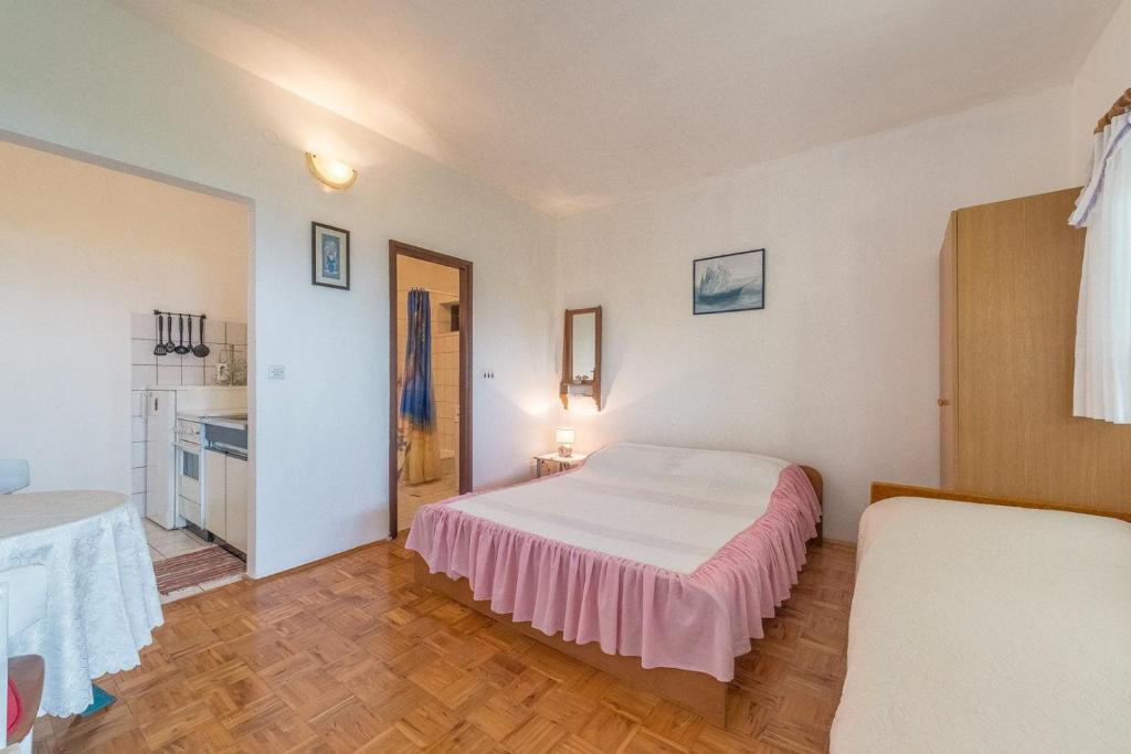 Posteľ alebo postele v izbe v ubytovaní Apartments Blaženka