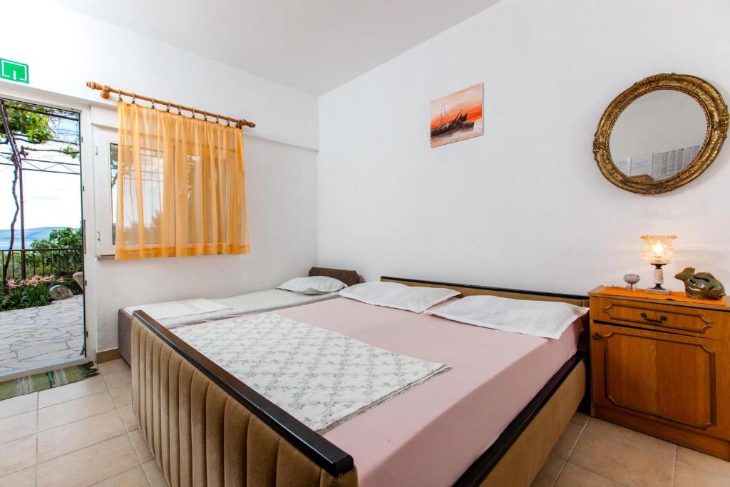 Posteľ alebo postele v izbe v ubytovaní Apartments Blaženka