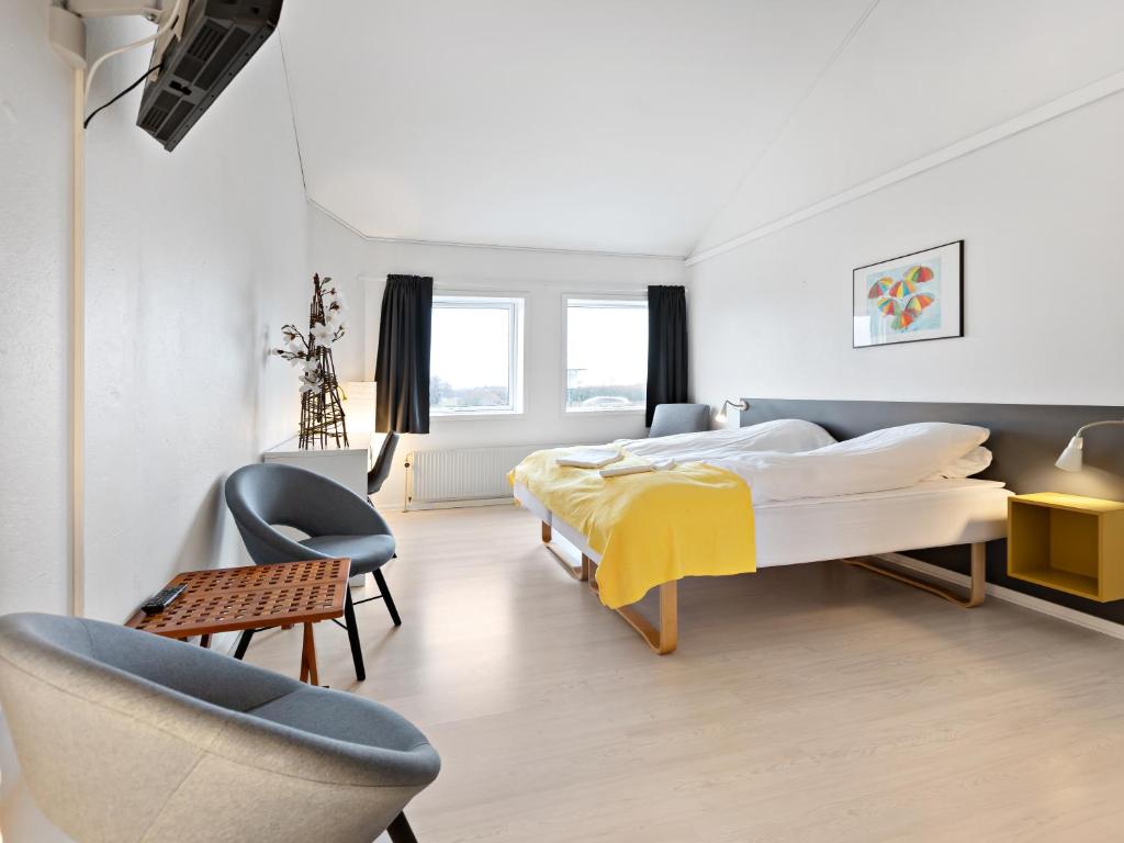 Postel nebo postele na pokoji v ubytování Løgstør Parkhotel