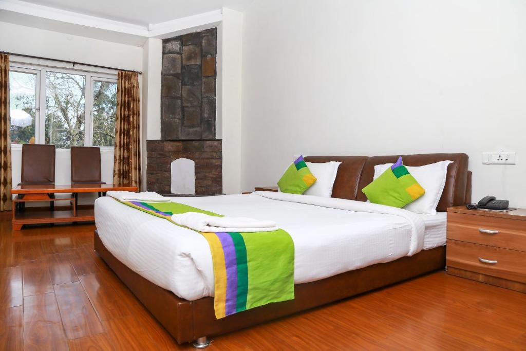 Postel nebo postele na pokoji v ubytování Yantra Resort By Spree Ooty