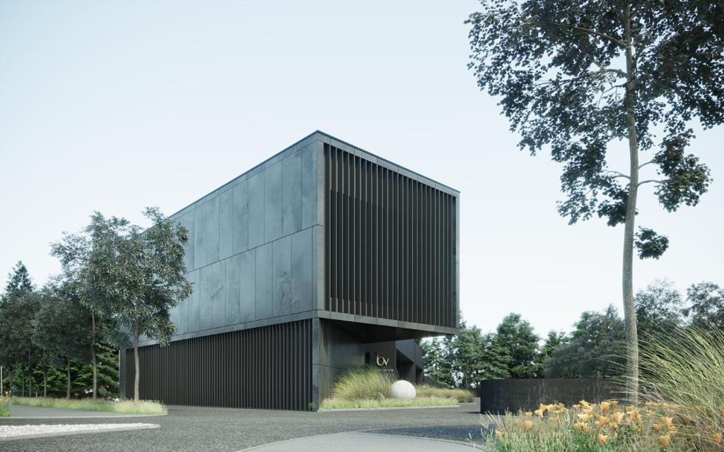 une maison avec une façade noire et un arbre dans l'établissement Bv hotel, à Brignano Gera dʼAdda