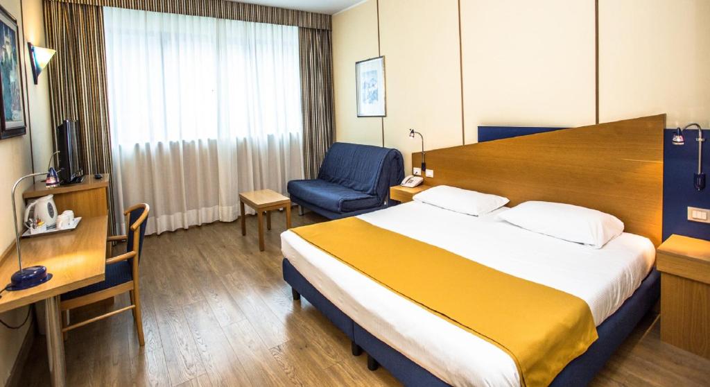 Postel nebo postele na pokoji v ubytování Hotel Express Aosta East