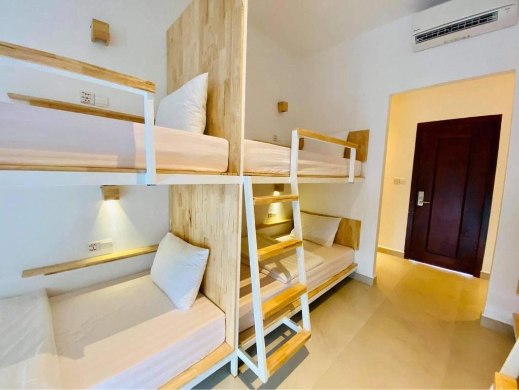 Postel nebo postele na pokoji v ubytování Onederz Kampot