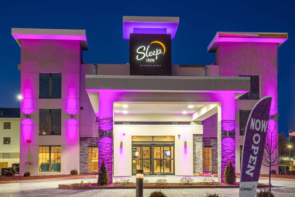 a building with purple lighting in front of it at Sleep Inn OakBrook Terrace - Chicago in Oakbrook Terrace