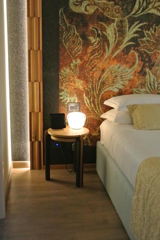 Postel nebo postele na pokoji v ubytování Hotel Firenze