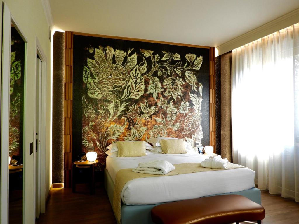 Postel nebo postele na pokoji v ubytování Hotel Firenze