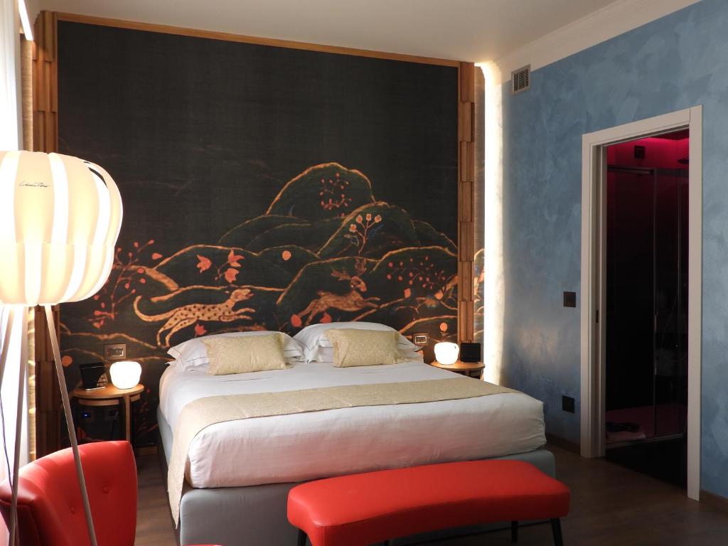 Postel nebo postele na pokoji v ubytování Hotel Firenze