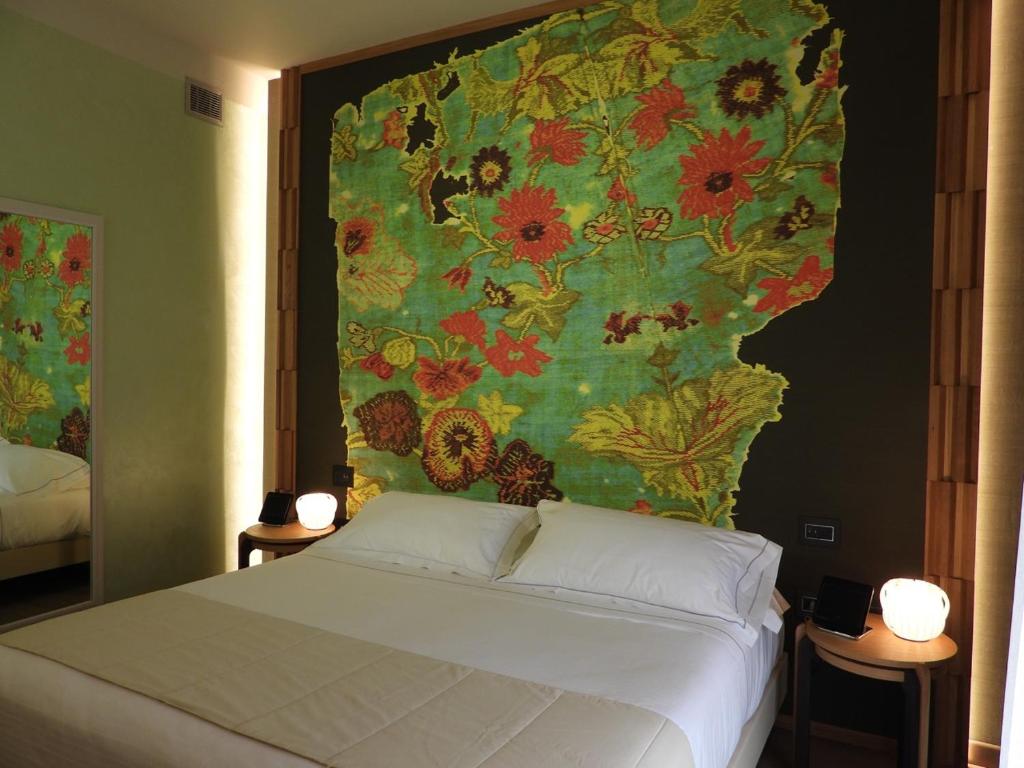 Postel nebo postele na pokoji v ubytování Hotel Firenze
