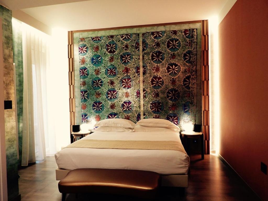 Postel nebo postele na pokoji v ubytování Hotel Firenze