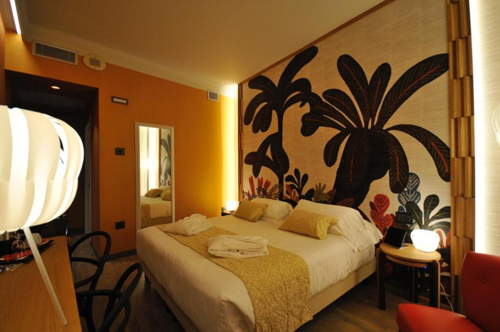 Postel nebo postele na pokoji v ubytování Hotel Firenze