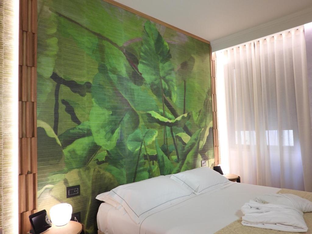 Postel nebo postele na pokoji v ubytování Hotel Firenze