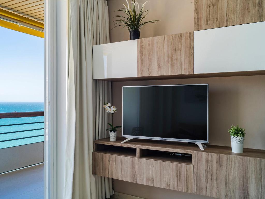 A television and/or entertainment centre at Apartment Castillo de Santa Clara-2 by Interhome