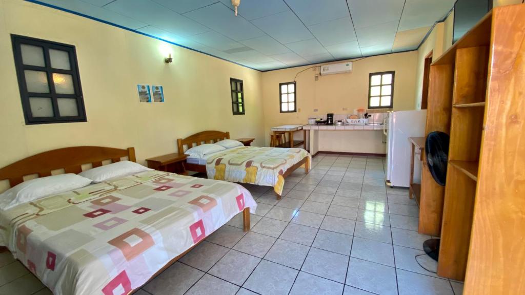 Postel nebo postele na pokoji v ubytování Hotel Moctezuma
