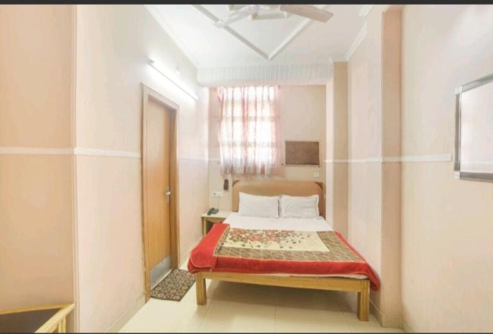 Postel nebo postele na pokoji v ubytování Hotel Queen