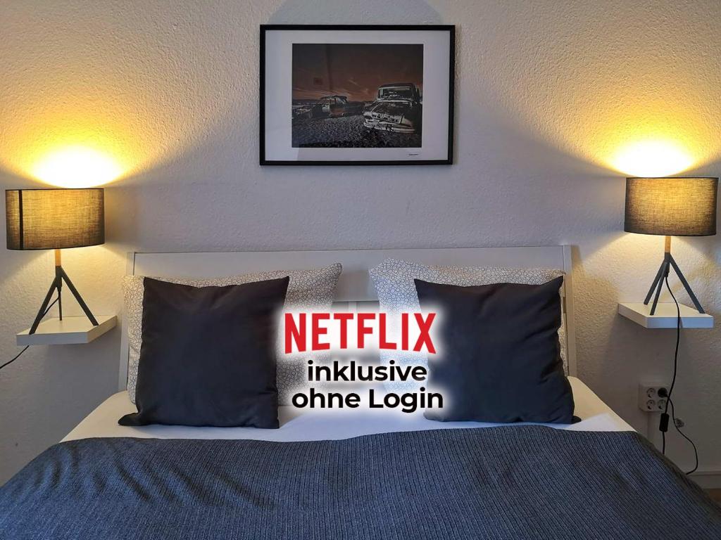 a bedroom with a bed with a netflix inclusive onion login pillow at Landlust Hotel in Gransee