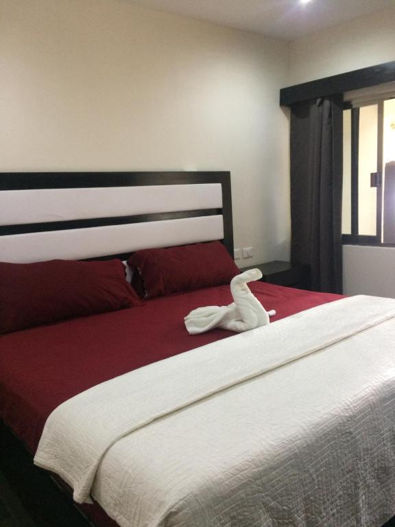 Postel nebo postele na pokoji v ubytování Hotel Sevilla Palenque
