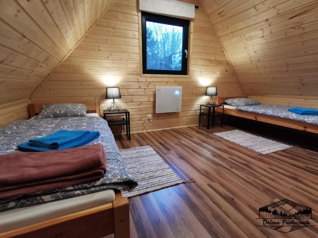 Postel nebo postele na pokoji v ubytování Domki Wisła Dolina Partecznik
