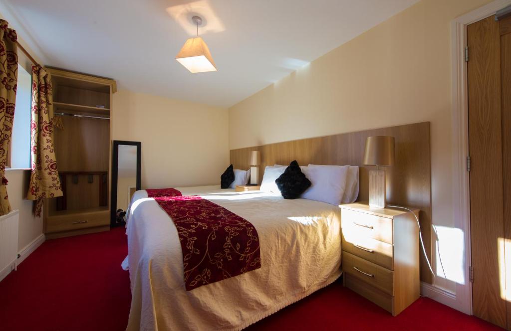 Postel nebo postele na pokoji v ubytování Aisleigh Guest House