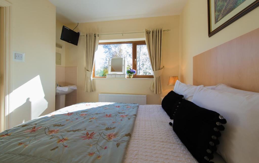 Postel nebo postele na pokoji v ubytování Aisleigh Guest House