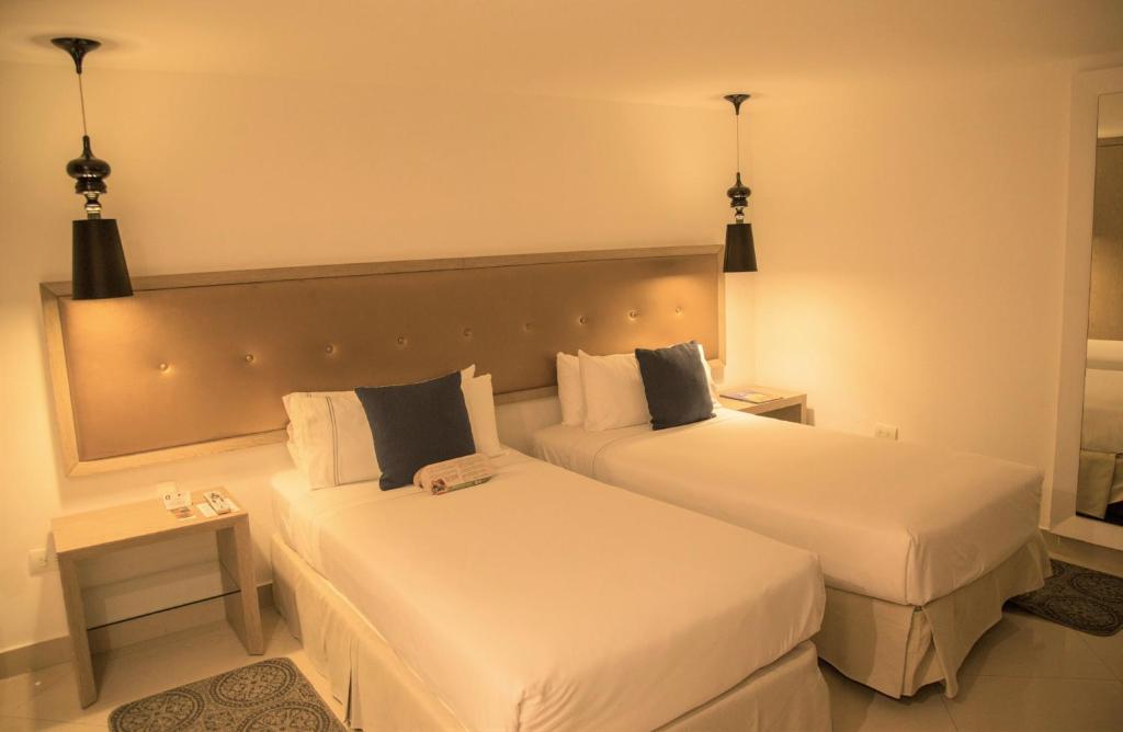 Postel nebo postele na pokoji v ubytování Hotel Santa Cecilia B&B