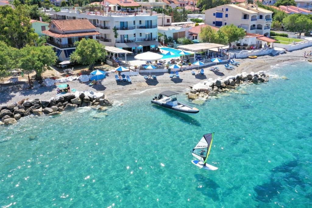 an aerial view of a beach with a boat in the water at Lido Hotel in Xylokastro