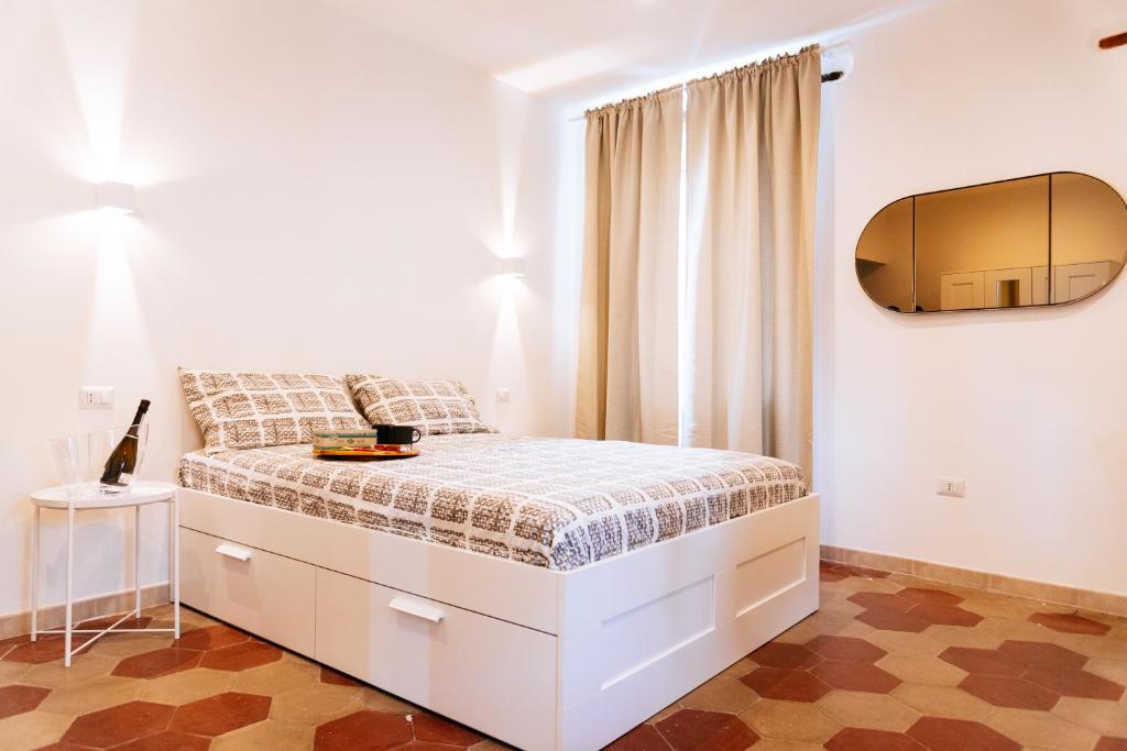 Posteľ alebo postele v izbe v ubytovaní Casa Aragona b&b