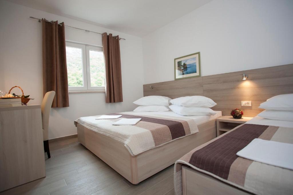 Posteľ alebo postele v izbe v ubytovaní Apartments Bota