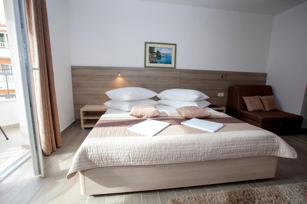 Posteľ alebo postele v izbe v ubytovaní Apartments Bota