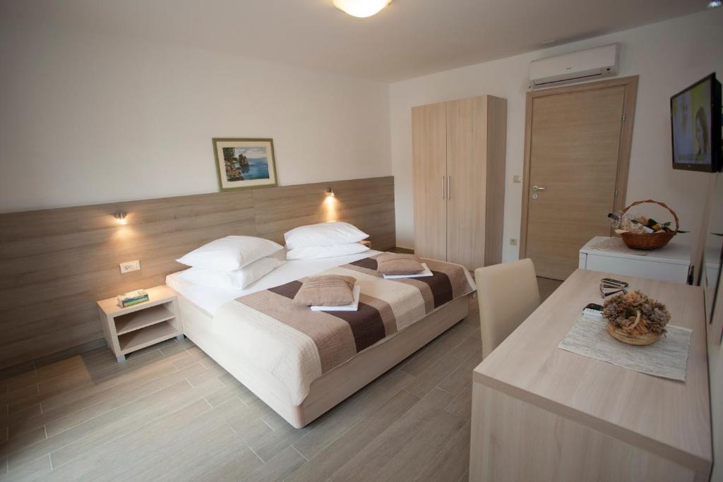 Posteľ alebo postele v izbe v ubytovaní Apartments Bota