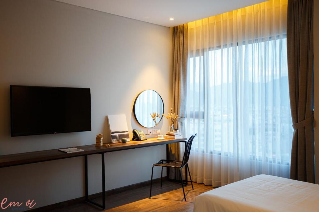 TV a/nebo společenská místnost v ubytování Em Oi Boutique Hotel