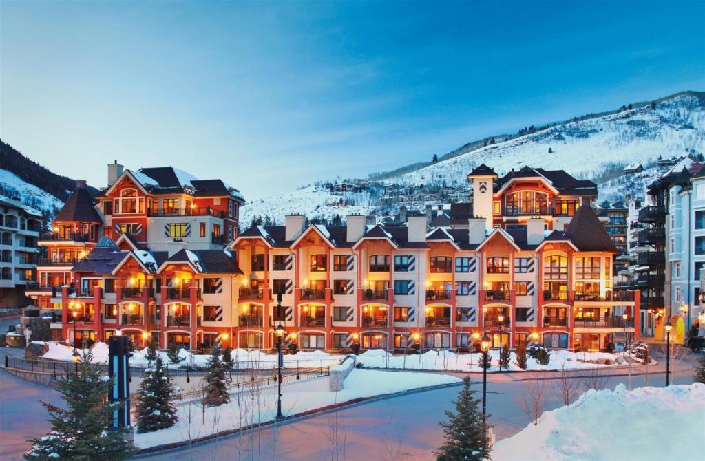 a resort in the mountains with snow at Luxury Ski In, Ski Out 2 Bedroom Mountain Residence In The Heart Of Lionshead Village With Heated Slope Side Pool And Hot Tub in Vail