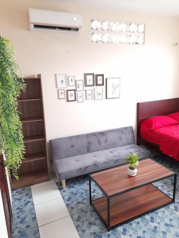 a living room with a couch and a coffee table at Alborada minisuites in Guayaquil