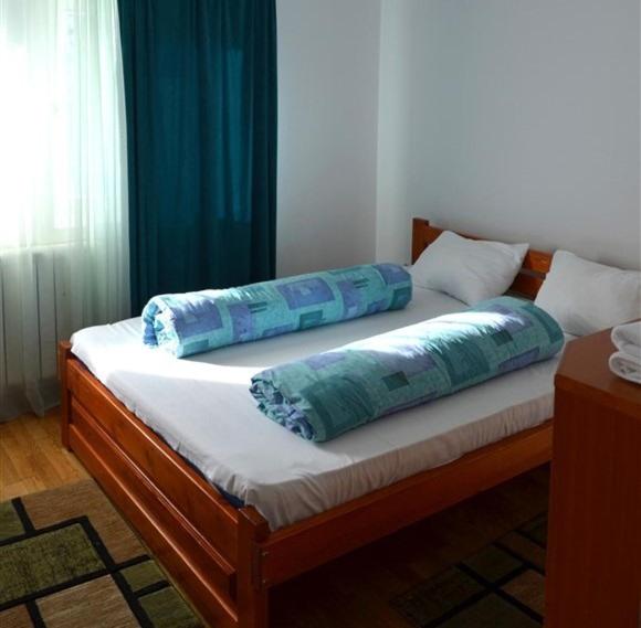 Postel nebo postele na pokoji v ubytování Vila IZVORUL MINUNILOR