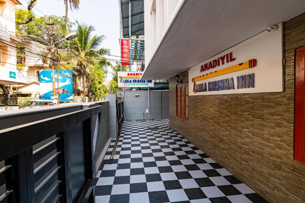 a checkered floor in front of a restaurant at ANADIYIL LEELAKRISHNA INN in Cochin